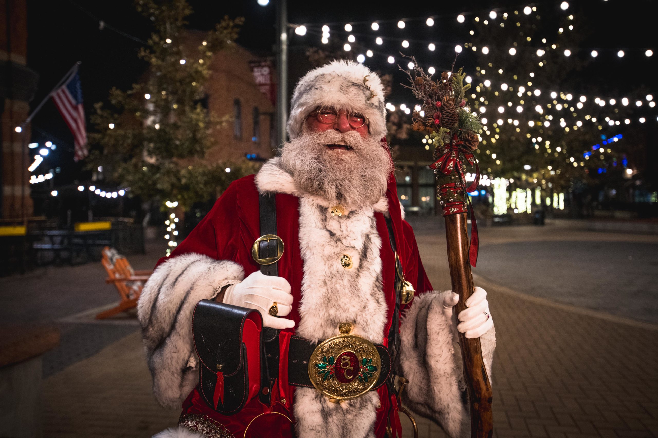 Jolly Santa Claus in Old Town Square on a winter evening