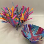 Two crafted colorful bird's nests