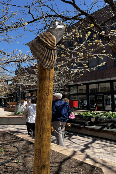 A sculpture of an owl on a pedestal.