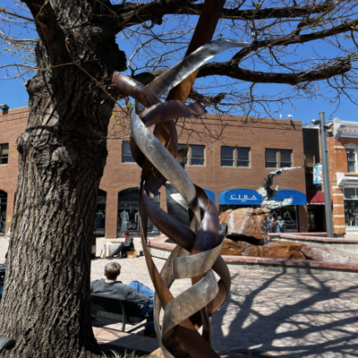 A sculpture of intertwined pieces of steel.
