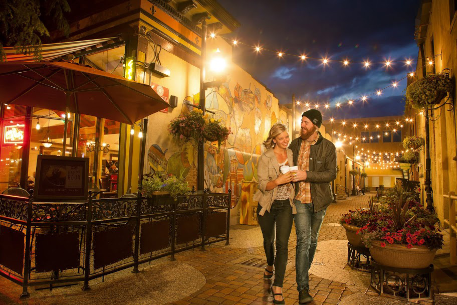 couple walking through downtown alley in Fort collins
