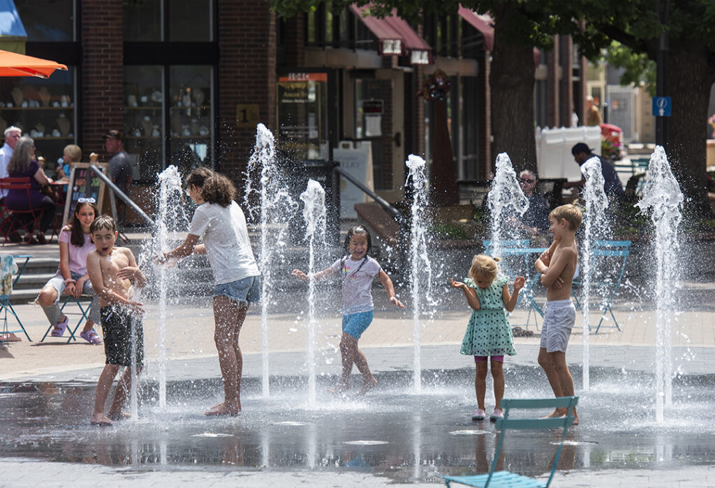 children in old town square splash pad