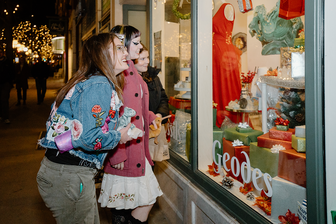 window shoppers at night in downtown fort collins