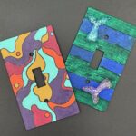 Two Light switch covers with artistic patterns