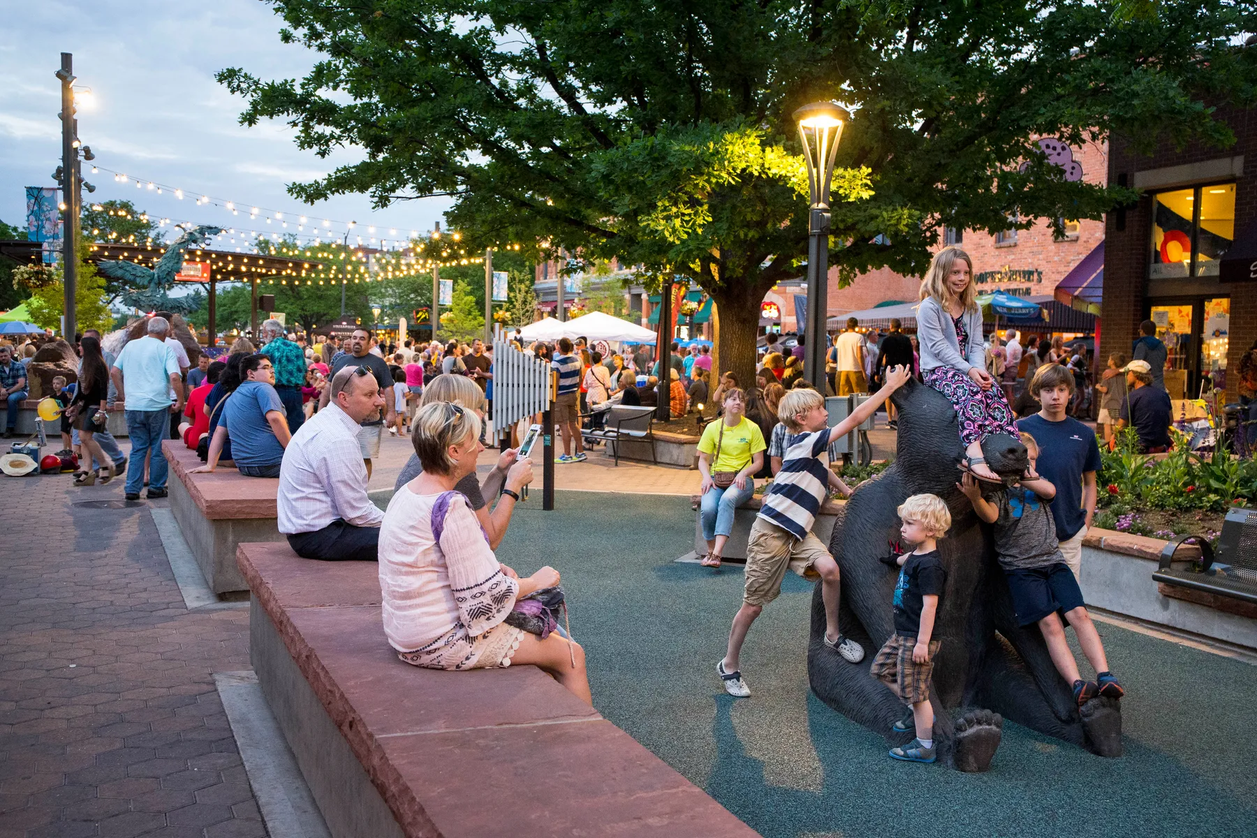 Kids playing in Old Town Square in Fort Collins